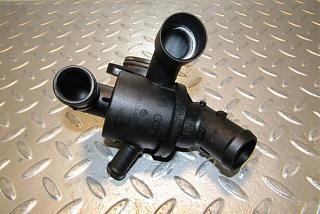 Замена термостата-03l121111ae-thermostat-housing-2012